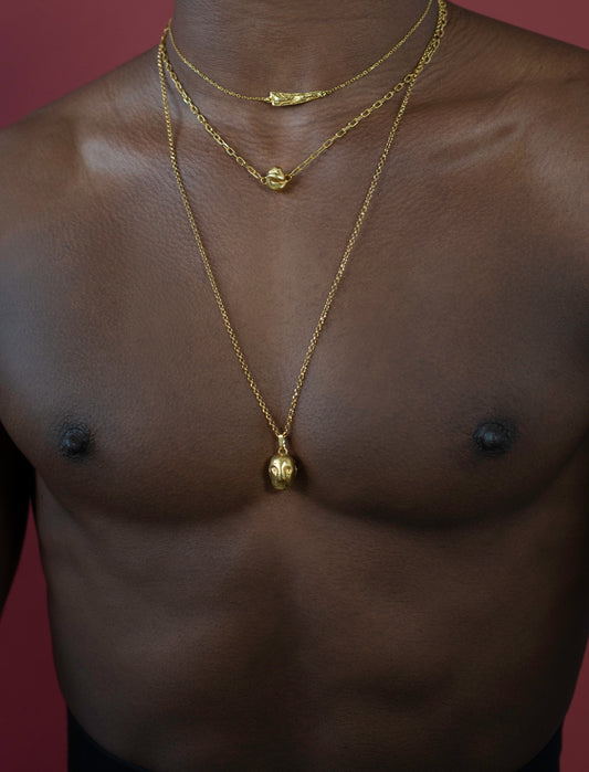 Model wearing gold vermeil chains inspired by celtic history