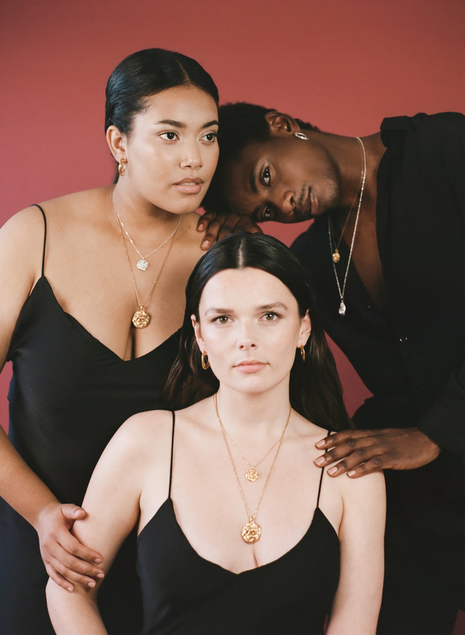 Models wearing Richard Murphy Jewellery with black slip dress and black shirt