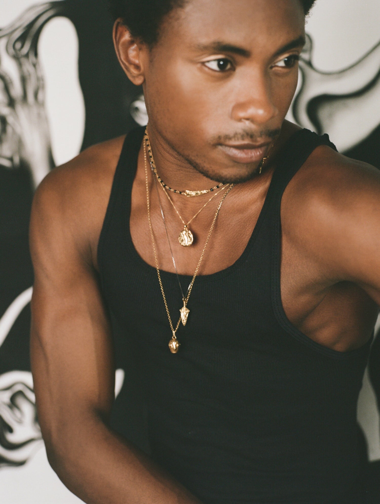 Model wearing 4 layered necklaces of Richard Murphy Jewellery