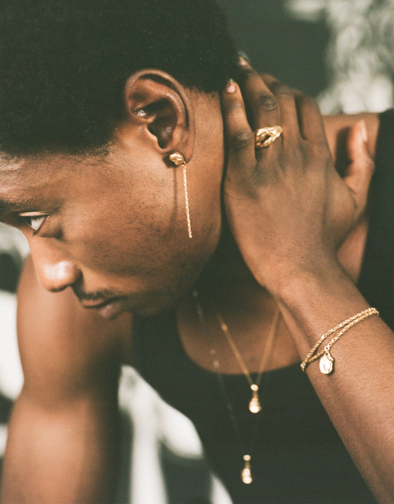 Model wearing gold vermeil drop earrings