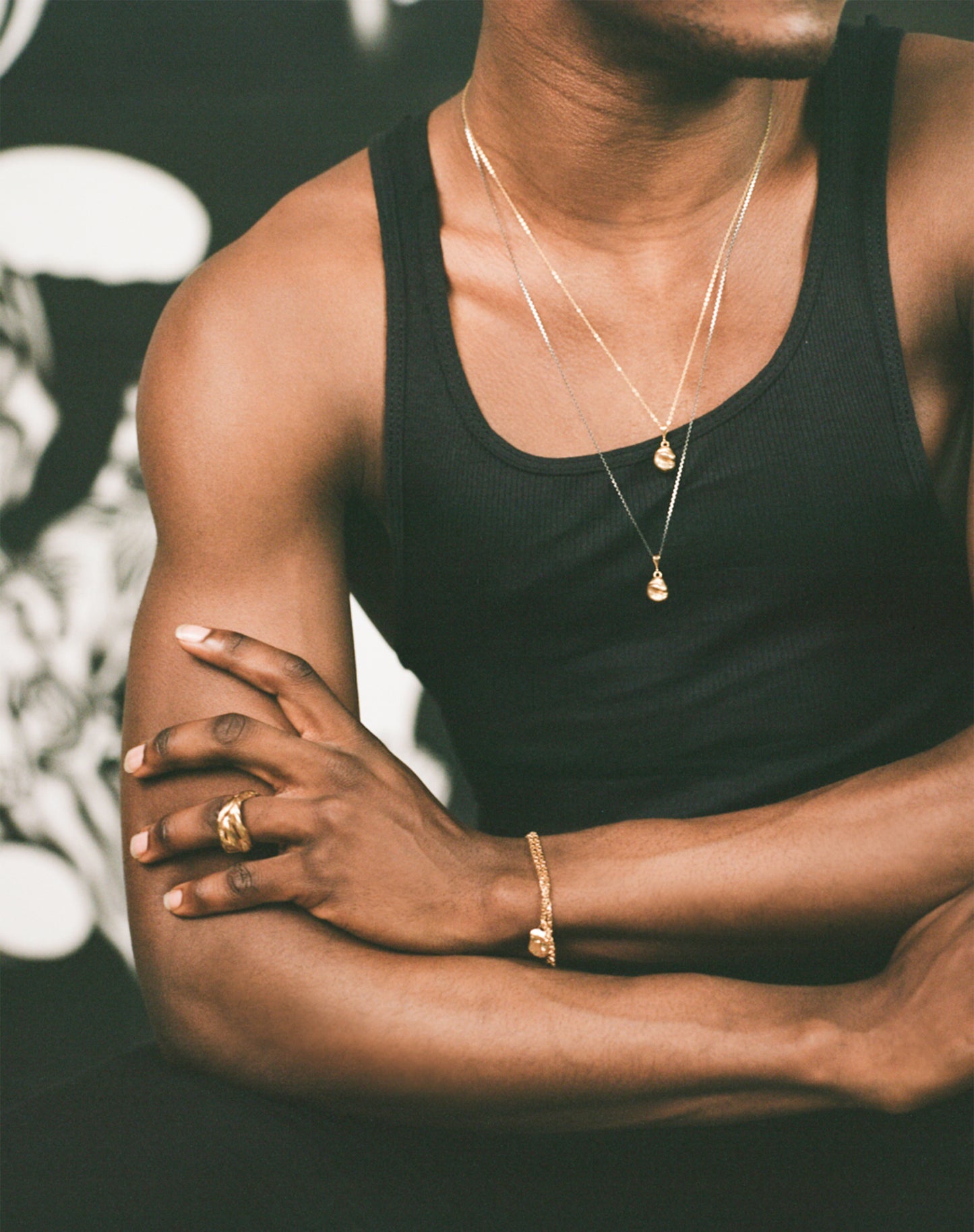 Model wearing Richard Murphy Necklaces, with bracelets and rings