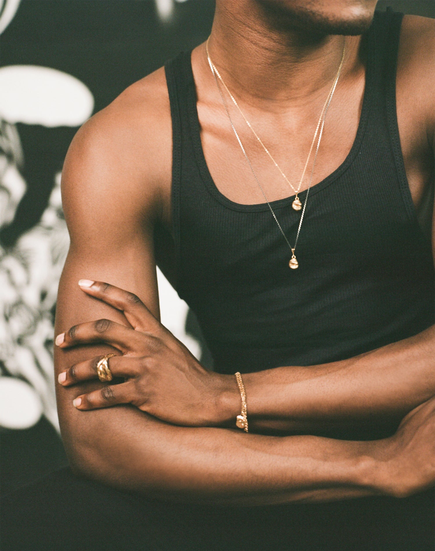 Model wearing Richard Murphy Necklaces, with bracelets and rings