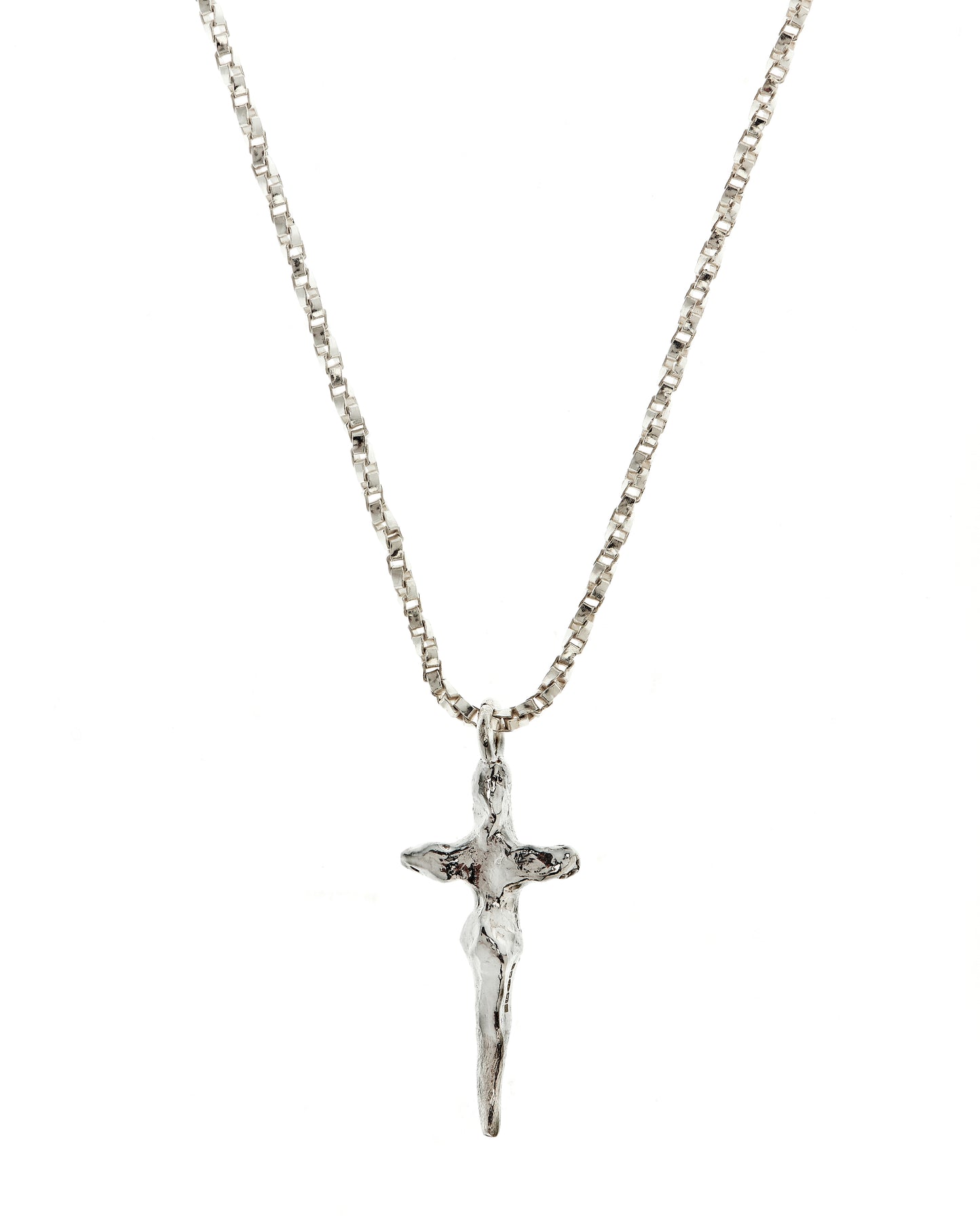 Close up of crucifix necklace in sterling silver