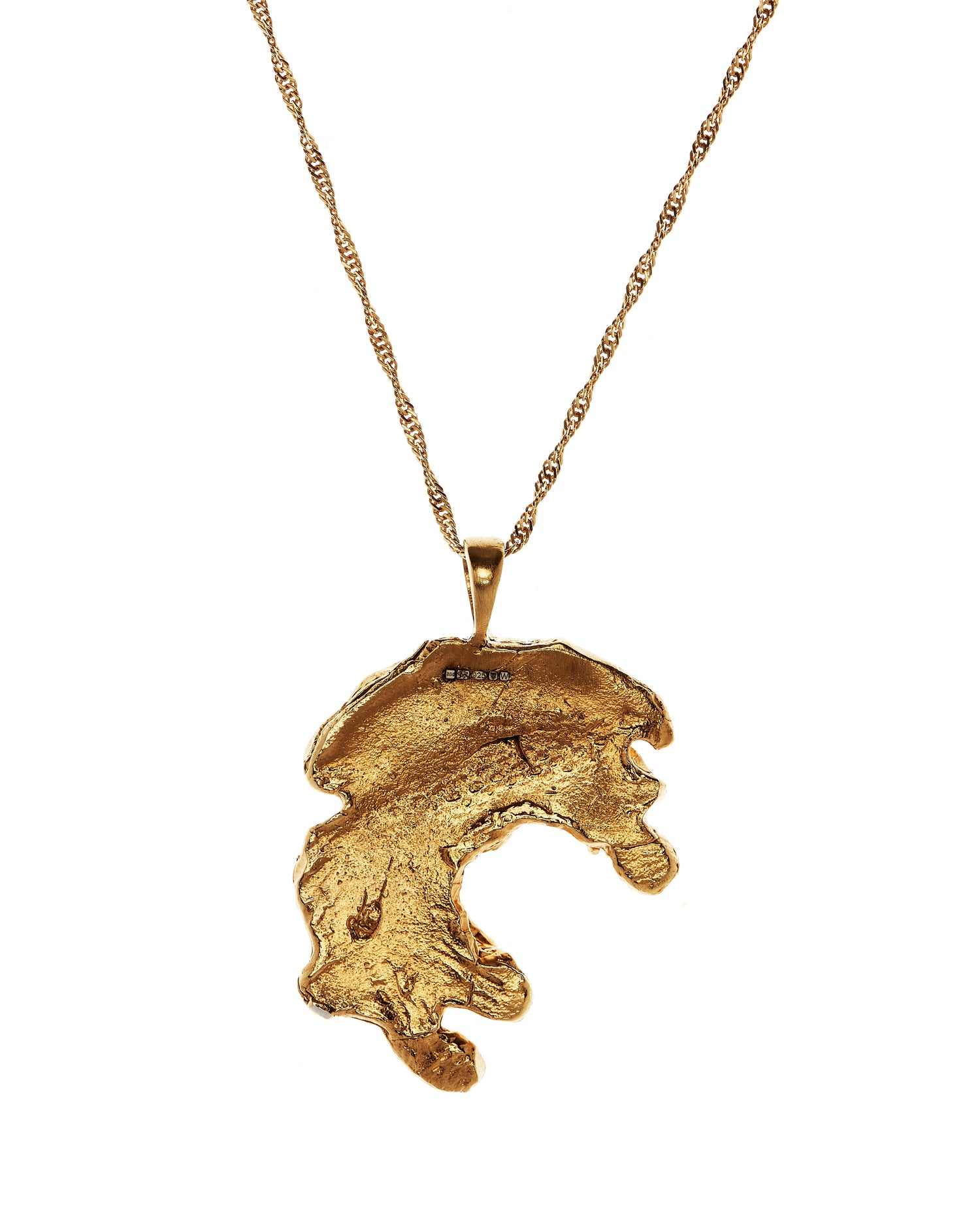 Gold textured pendant inspired by ancient Irish carvings.