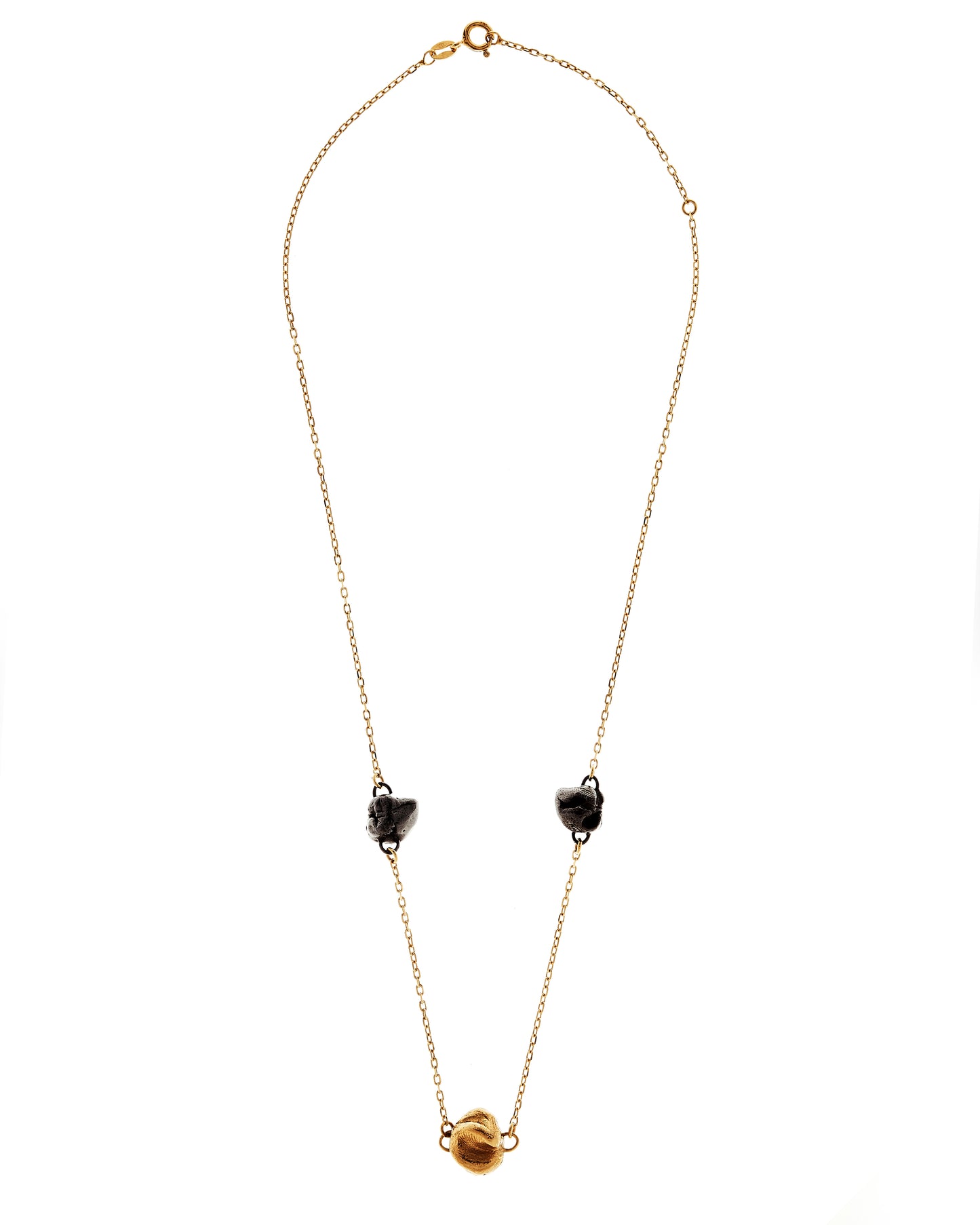 Close up of chain with gold and black rhodium castings