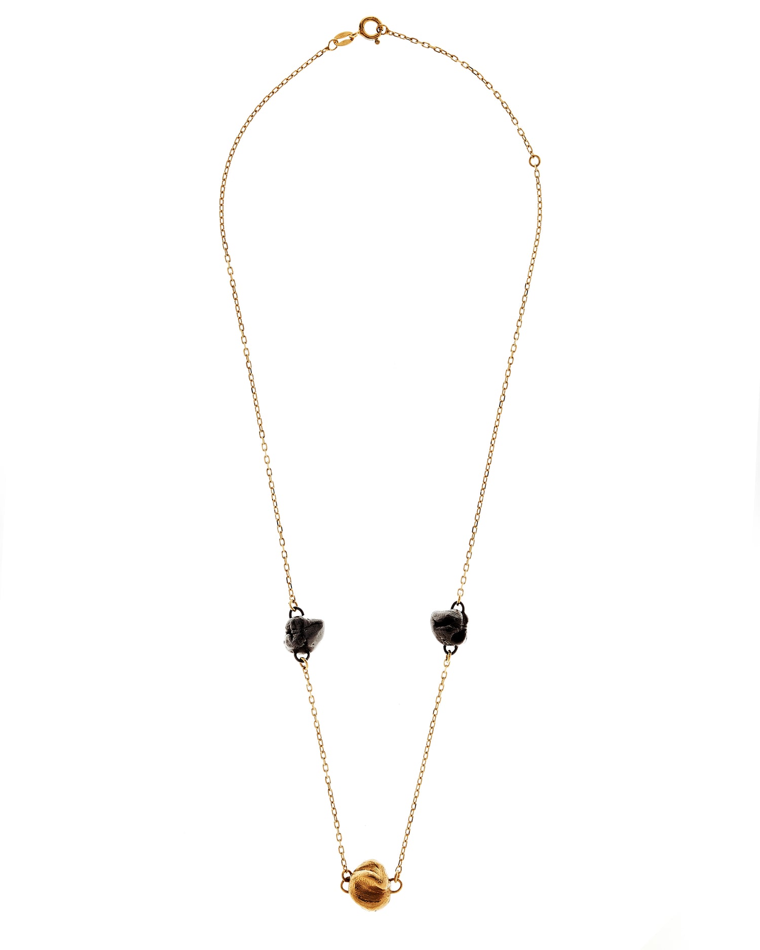 Close up of chain with gold and black rhodium castings