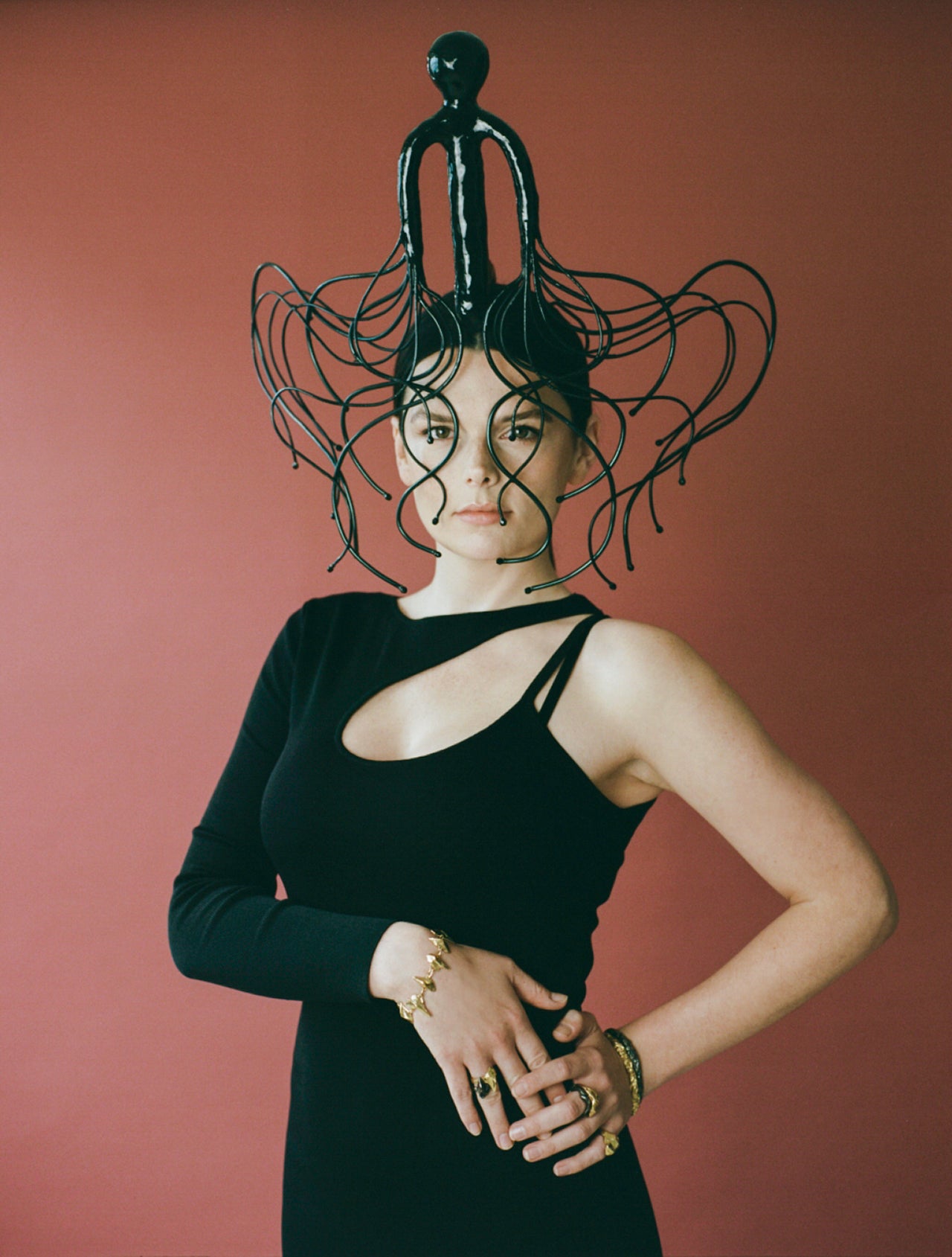 Model wearing black headpiece and Richard Murphy Jewellery