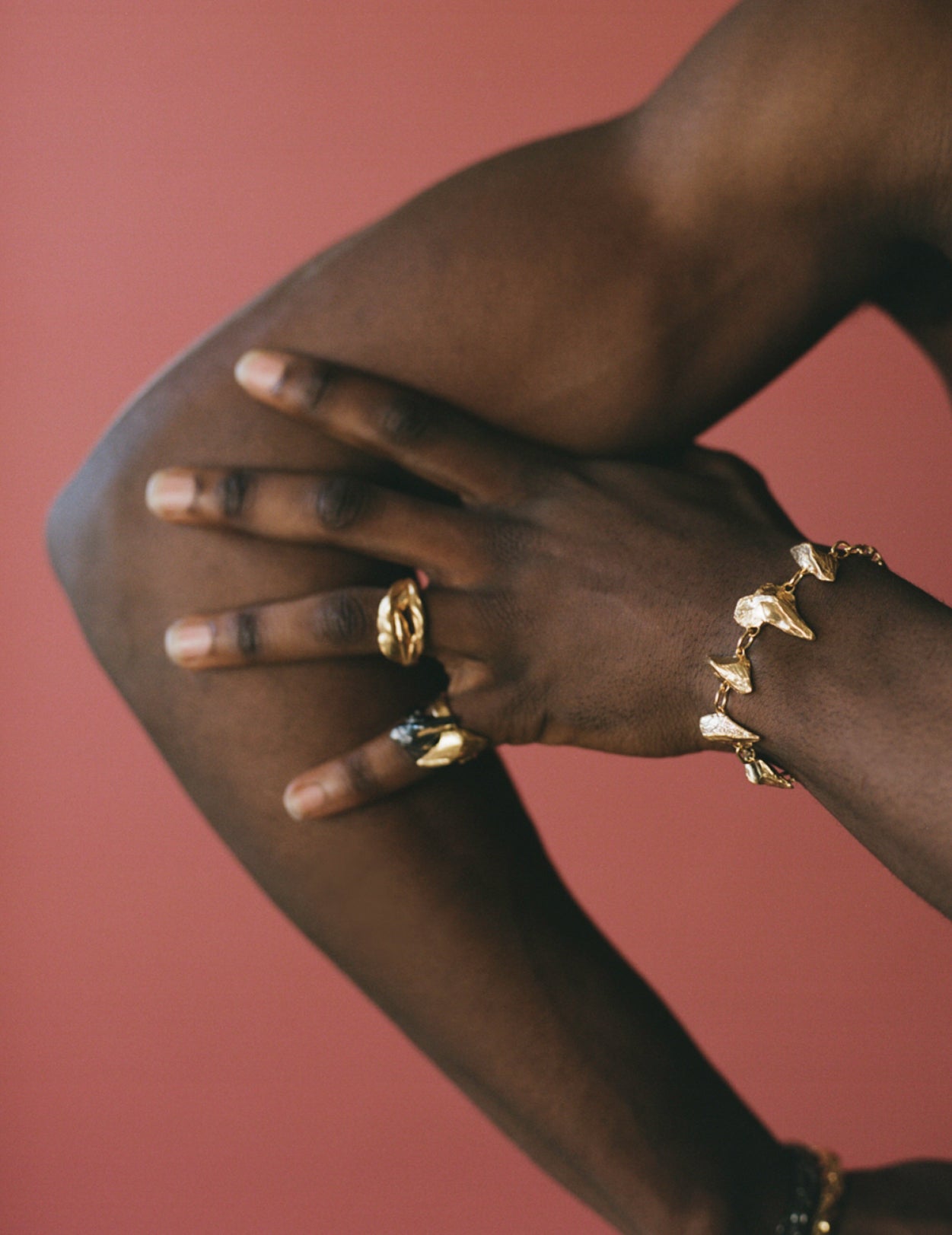 Model wearing gold vermeil rings and bracelet inspired by Irish history