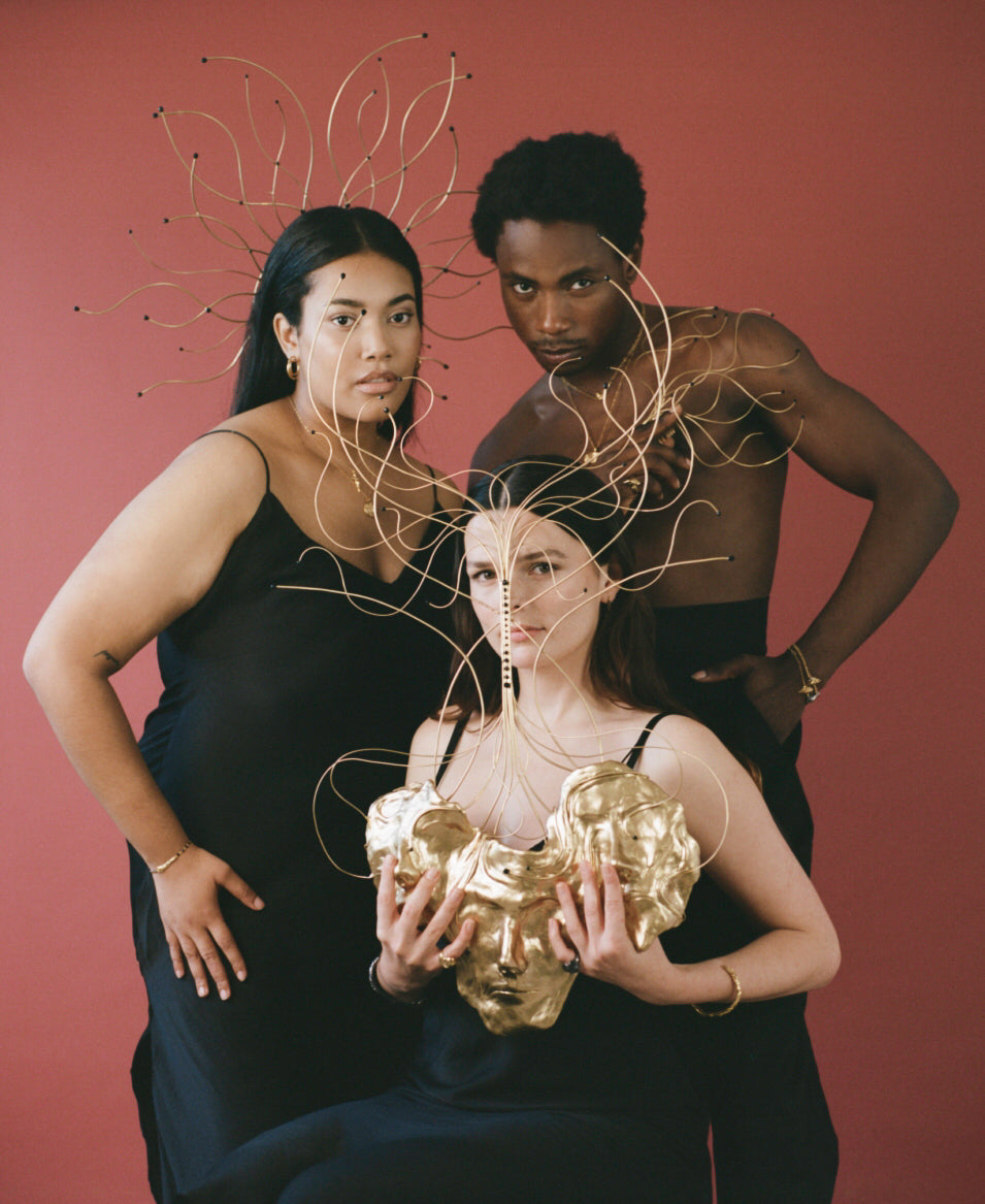 3 models posing with gold wire headpieces