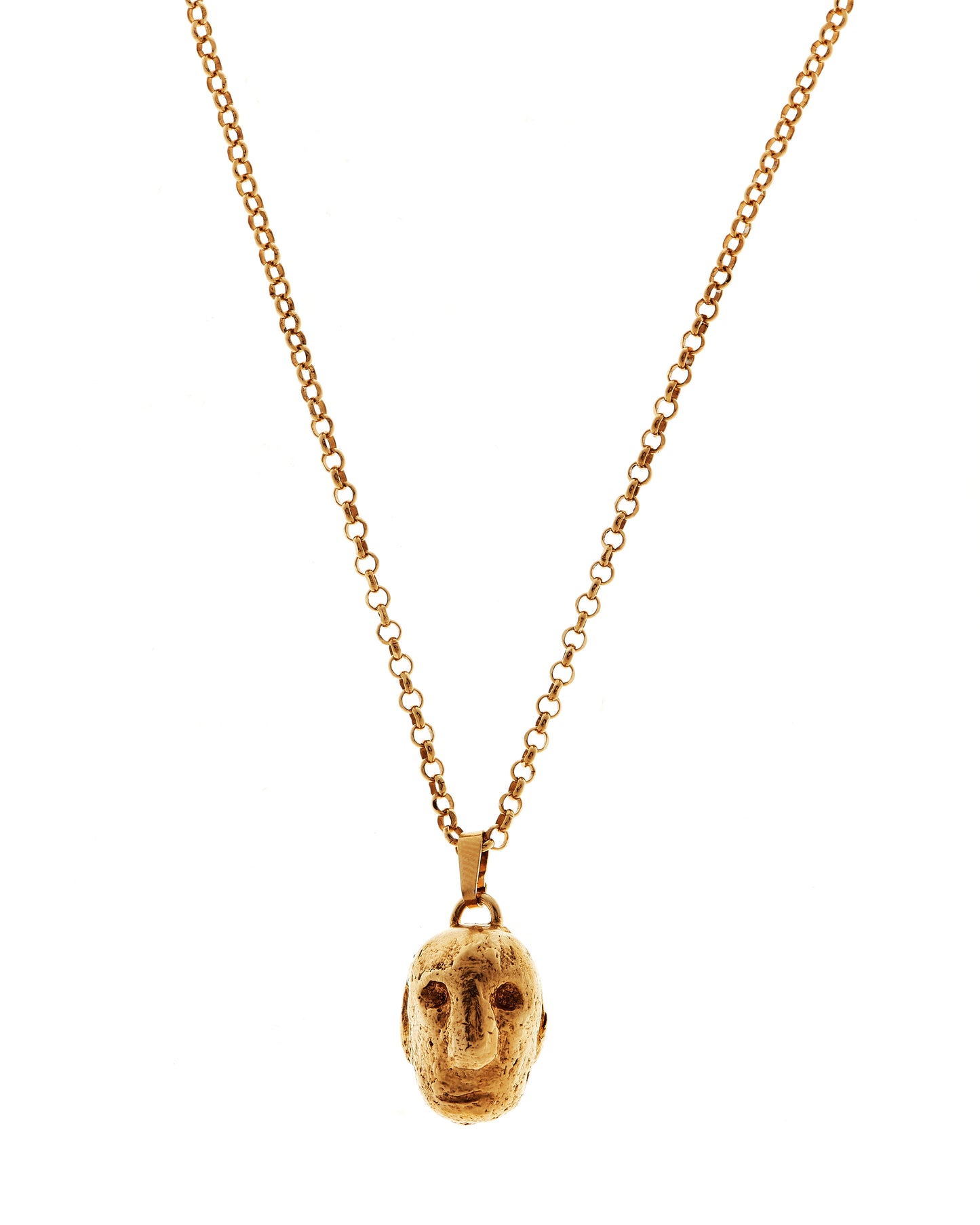 Close up of one of the 3 faces on this gold vermeil pendant