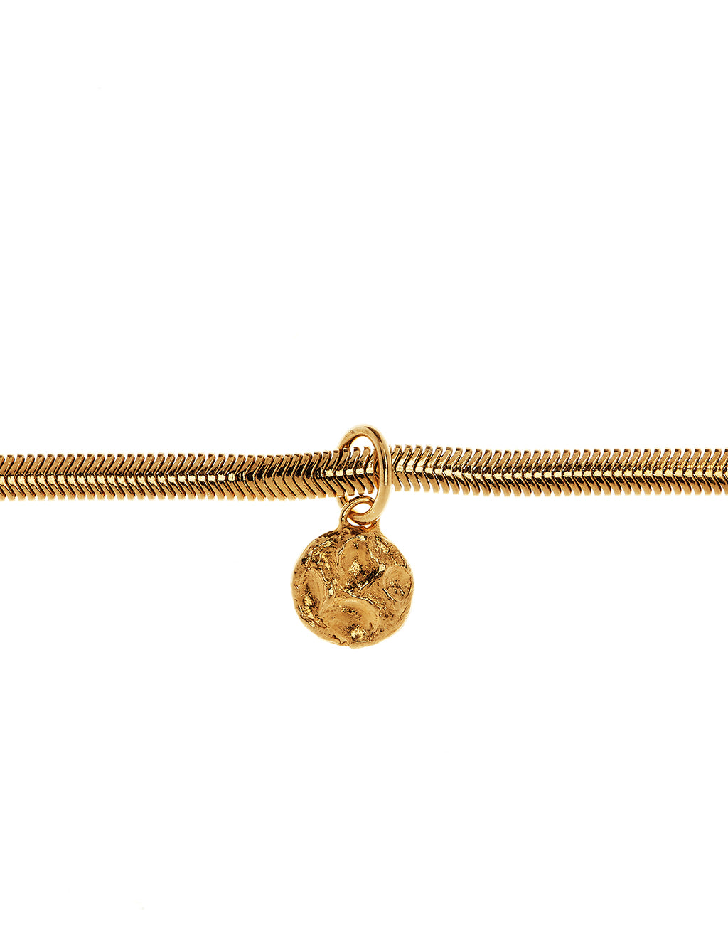 Close up of textured gold vermeil pendant